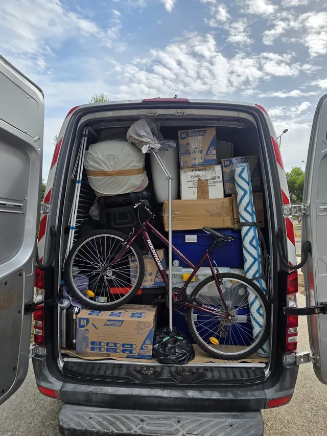 A full load: boxes, bicycle, rug and fragile items